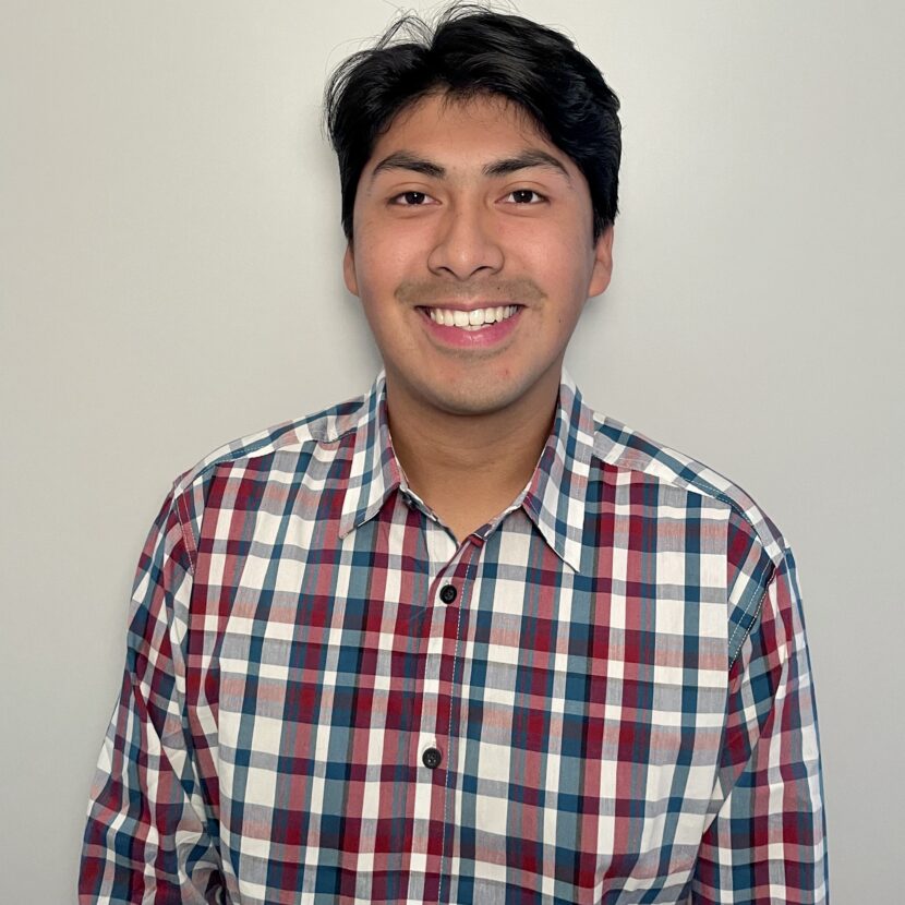 a photo of an Opportunity Scholar in a plaid shirt