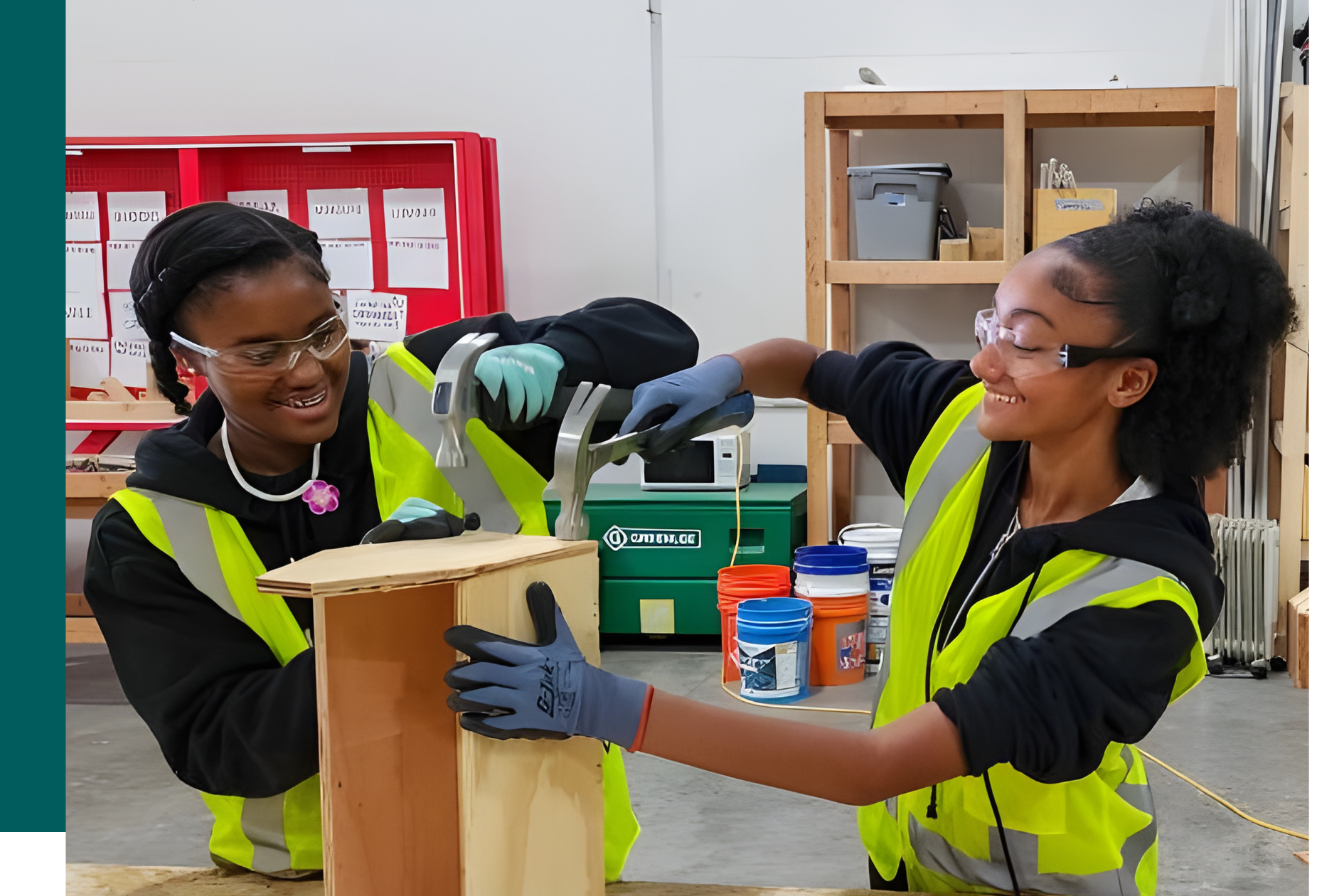 two female students working on a wood block