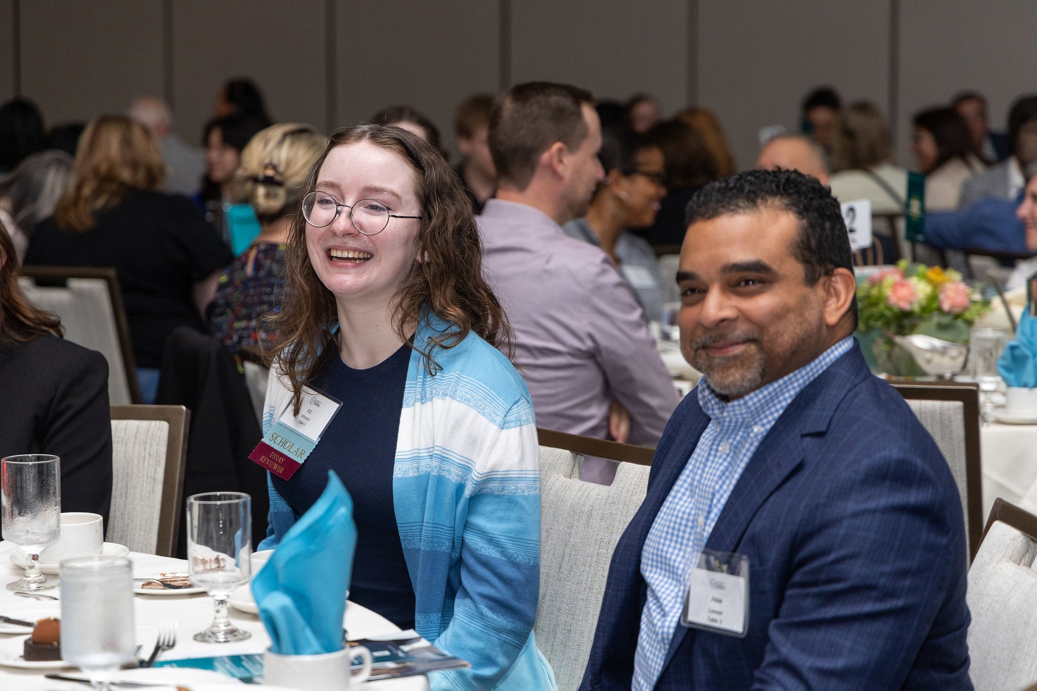 A Scholar sitting next to an  executive at OpportunityTalks 2026
